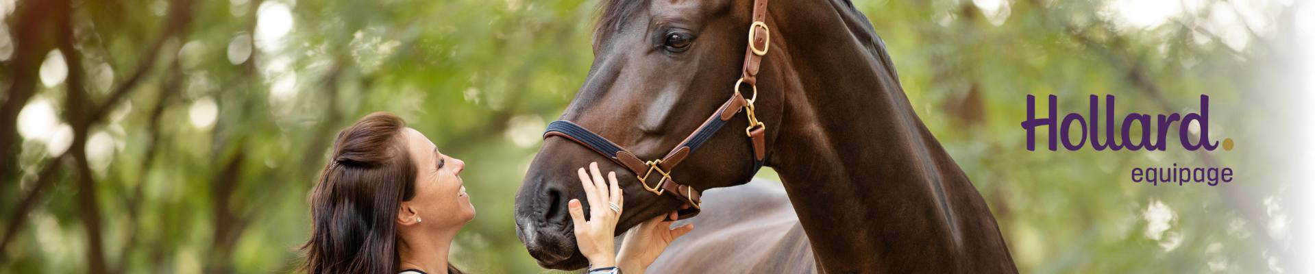 A Hollard Equipage client adjusting her horse's muzzle.