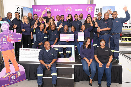 Thabani Kubeka in a group on stage, all happily waving at the camera